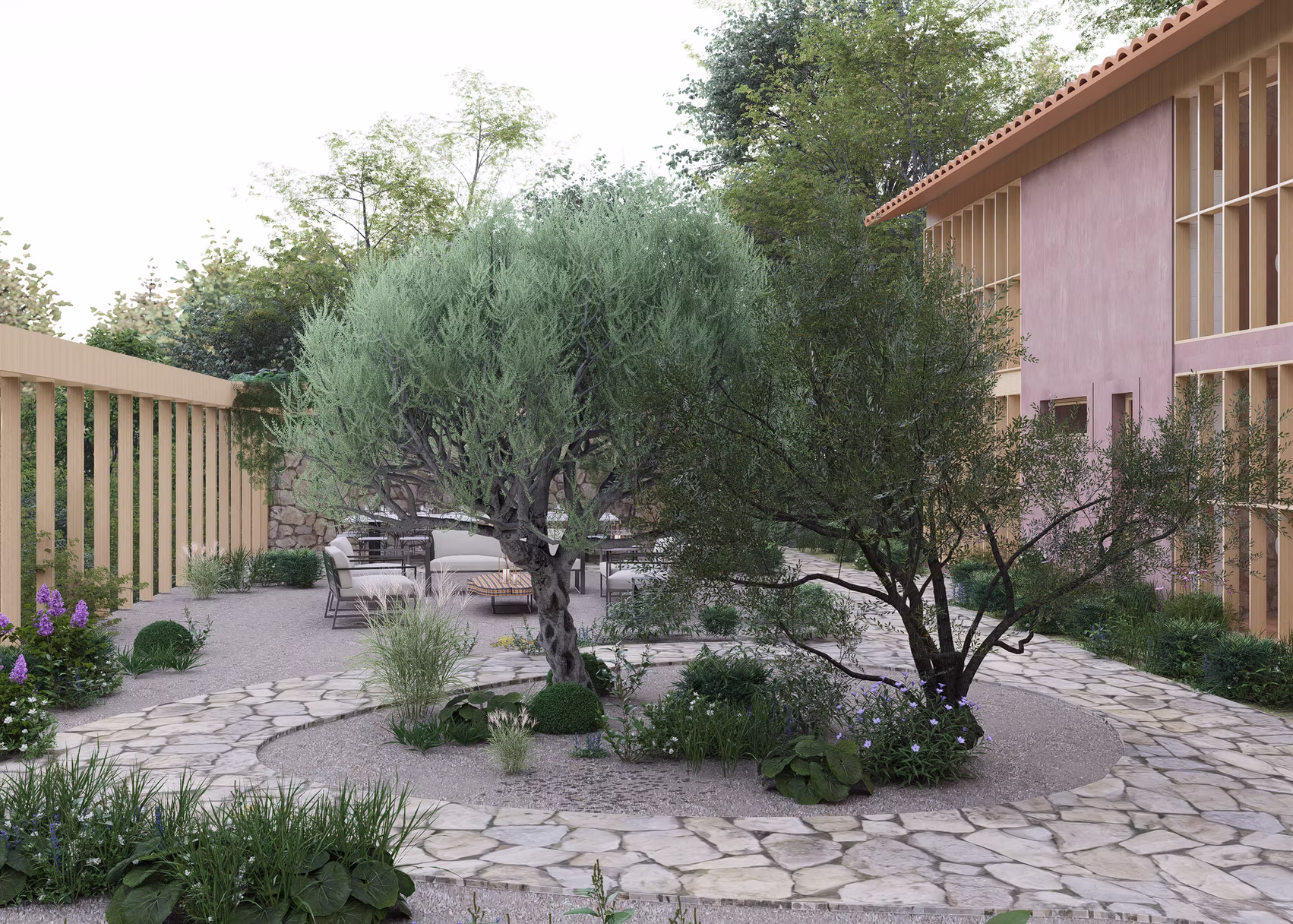 Mediterranean gravel courtyard with olive trees, stone paving and lounge seating by the restaurant wing, Hyderabad