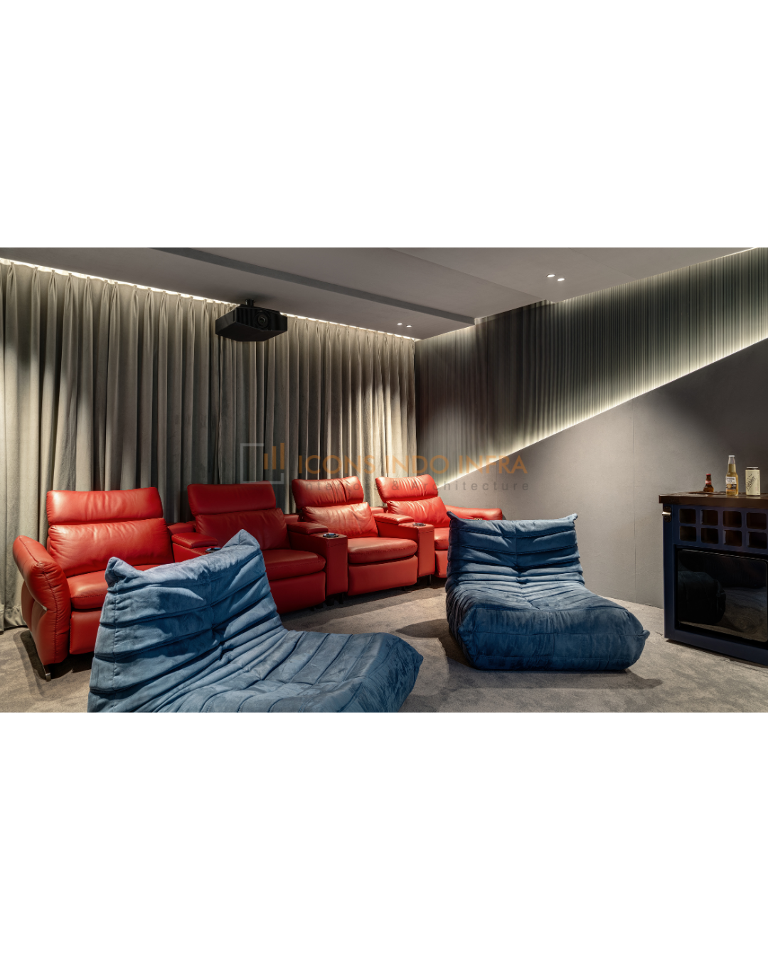 Home theatre rear view with red recliners, blue floor loungers, grey drapes and ceiling projector under cove lighting