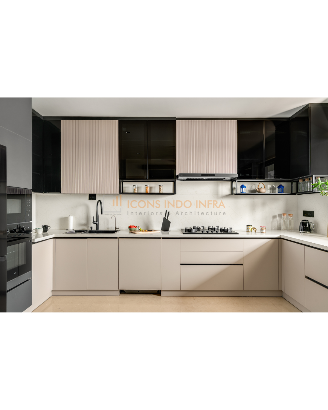 U-shaped modular kitchen in Hyderabad with glossy black and pale wood cabinets, white quartz counters and built-in hob