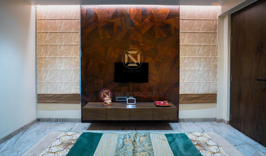 Living wall with geometric walnut panelling, floating console and embroidered Roman blinds, Hyderabad