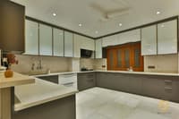 U-shaped modular kitchen with glossy grey cabinets, frosted-glass uppers, marble backsplash and wood pantry, Hyderabad