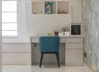 White study desk with overhead storage cubbies, teal upholstered chair and marbled blue accent wall, Hyderabad