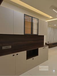 Crockery cabinet with white shutters, fluted-glass uppers, dark woodgrain back panel and open niche, Hyderabad home