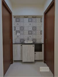 Washbasin nook with Moroccan-pattern tile backsplash and vessel sink flanked by teak doors, Hyderabad