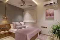 Blush-toned bedroom in Hyderabad with wood platform bed, mauve quilt, woven headboard and geometric pendant light