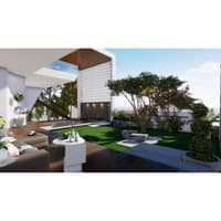 Courtyard with lattice screen, stone wall, lawn and lounge chairs viewed from a cushioned outdoor sofa, Hyderabad farmhouse