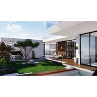 Landscaped courtyard with manicured lawn, ornamental tree and pool beside a glass-walled modern farmhouse, Hyderabad