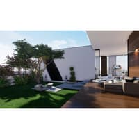 Backyard lawn and angled wall feature beside a sofa and timber deck in an open-plan farmhouse, Hyderabad