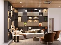 Living room with floor-to-ceiling fluted display shelving, curved cream sofa, brown leather chair and timber-slat ceiling, Hyderabad