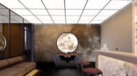 Reception lounge with backlit moon-motif feature wall, marble desk, bench seat and gridded ceiling, Hyderabad