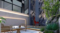 Courtyard seating with rattan chairs, a backlit marble wall, rock-clad feature panel and red wire sculpture, Hyderabad