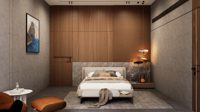 Bedroom with vertical wood-slat feature wall, grey marble headboard panel and tan leather lounge chair, Hyderabad