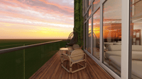 Wood-deck balcony with woven lounge chairs and side table overlooking a glowing sunset skyline, Hyderabad
