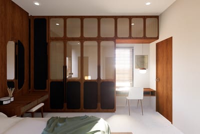 Master bedroom with cane-fronted wardrobe, black accent panels, dressing table and green bed throw, Hyderabad