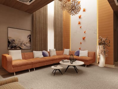 Living room featuring a curved terracotta sectional, paired nesting tables and floral wall art, Hyderabad home interiors