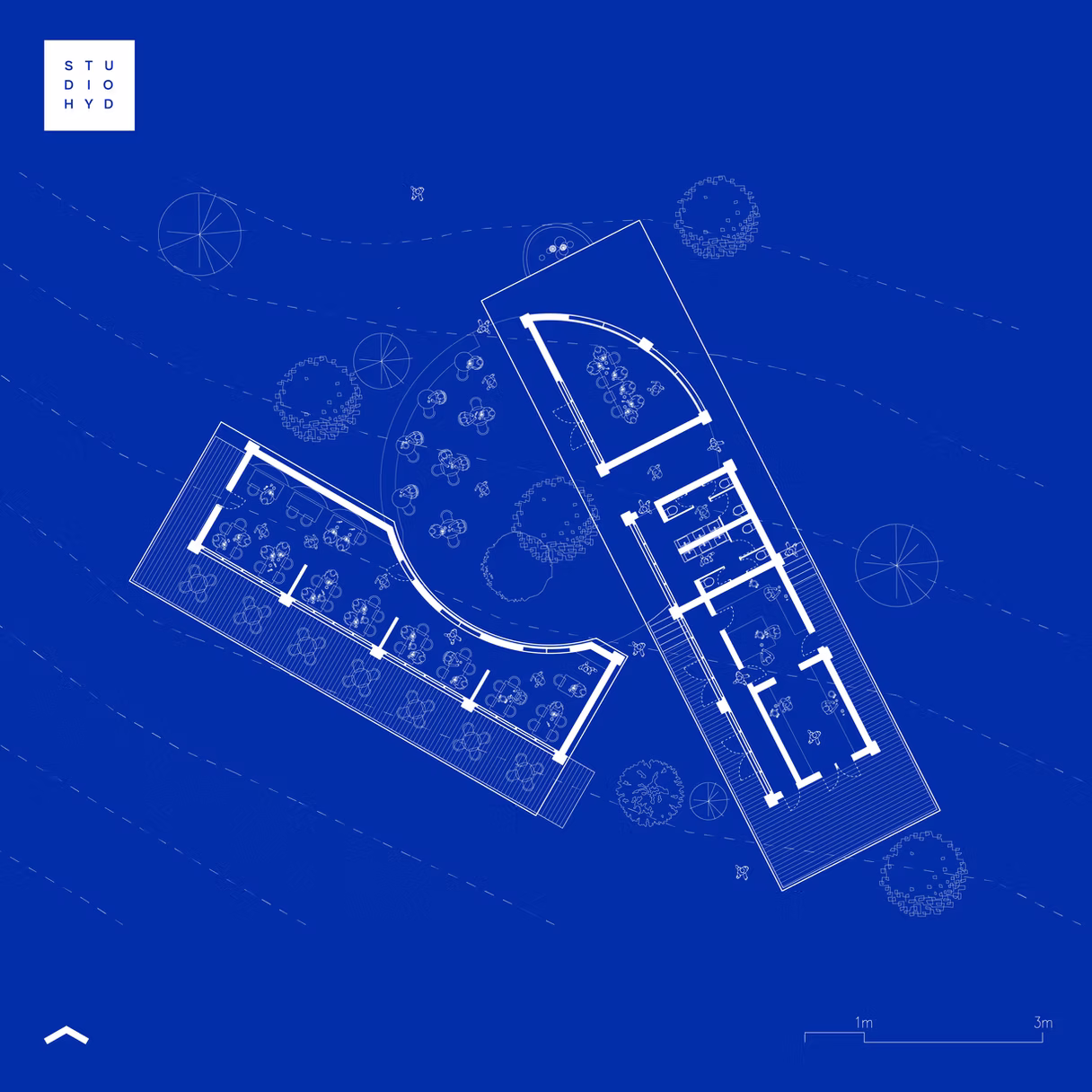 Blueprint floor plan of Rachakonda Cafe showing two angled wings and a scale bar, by Studio Hyderabad