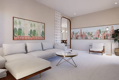 Living room with white sectional, framed Indian heritage city artwork, arched mirror and round gold coffee table, Hyderabad