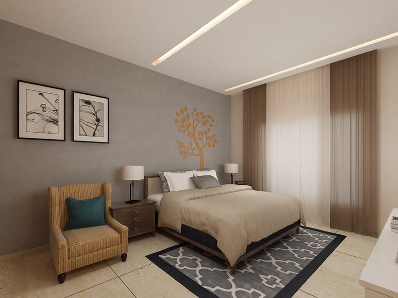 Cozy Hyderabad bedroom with textured grey accent wall, beige bedding, striped wingback chair and tree wall decal