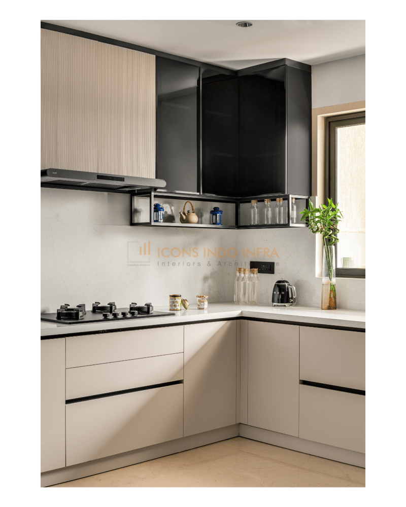L-shaped kitchen with cream fluted and glossy black cabinets, stainless chimney and white quartz countertop, Hyderabad
