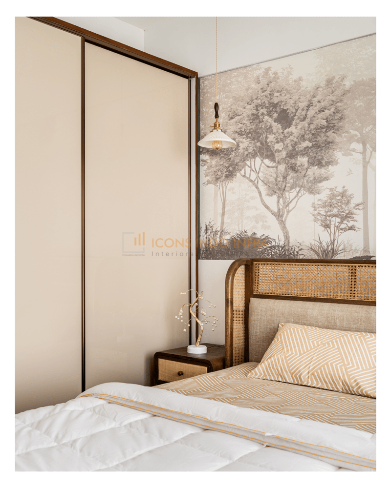 Guest bedroom corner close-up: cane headboard against a forest mural, ribbed sliding wardrobe and a brass pendant light