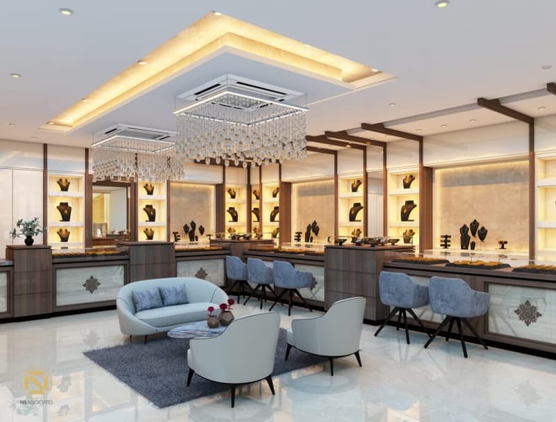 Jewellery showroom retail floor with mirrored display counters, pendant chandeliers and customer seating, Hyderabad
