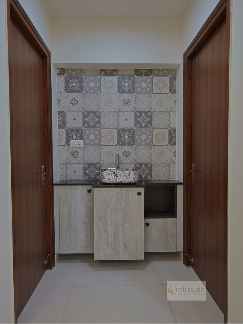 Washbasin nook with Moroccan-pattern tile backsplash and vessel sink flanked by teak doors, Hyderabad