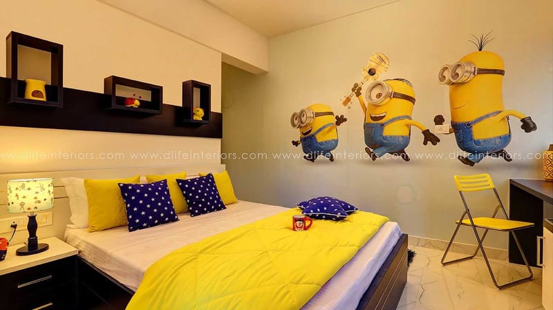 Children's bedroom with Minions wall art, yellow bedspread, navy polka-dot cushions and black box shelves, Hyderabad
