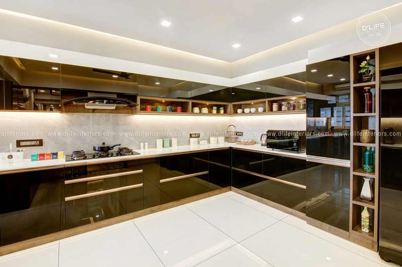 L-shaped modular kitchen in glossy black laminate with open shelves and recessed ceiling lights, Hyderabad
