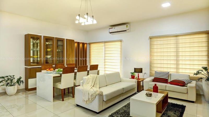 Open living-dining room with white sofas, glass crockery cabinet and sputnik pendant light, Hyderabad