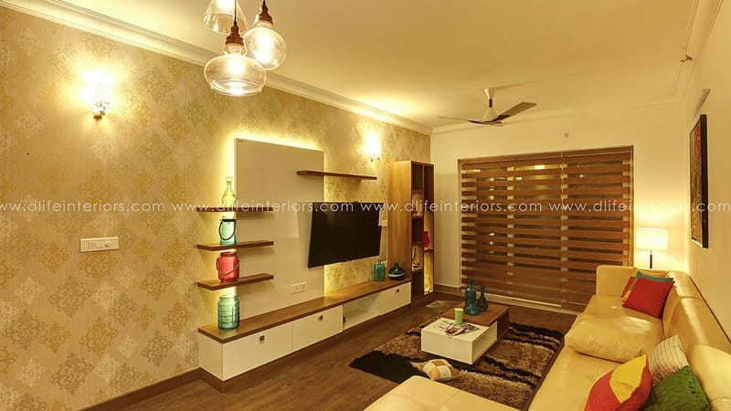 Living room with backlit TV niche, floating shelves, wooden blinds and beige sofa under glass pendant lights, Hyderabad