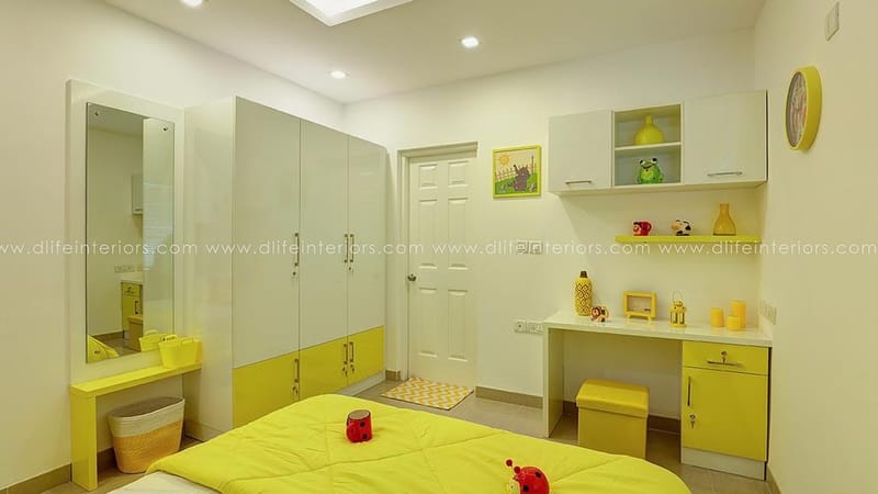 Kids bedroom in white and yellow with two-tone wardrobe, study desk and full-length mirror, Hyderabad full-home interior