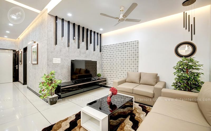 Living room with slatted feature wall, black TV console, beige loveseat, indoor plant and shaggy rug, Hyderabad