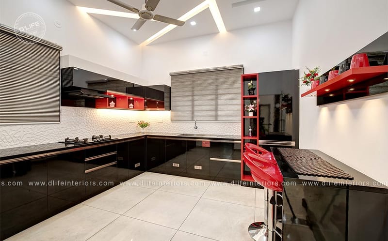 Black and red glossy modular kitchen with L-shaped counter, breakfast bar stools and zebra blinds, Hyderabad full home