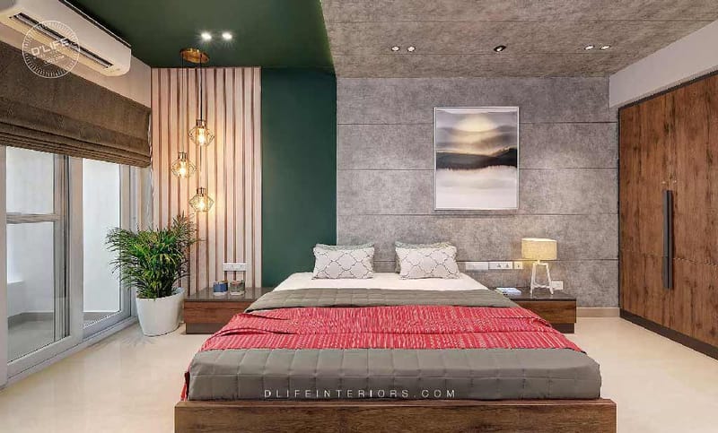 Bedroom with platform wood bed, red and grey bedding, green accent wall, fluted panel and pendant cluster, Hyderabad