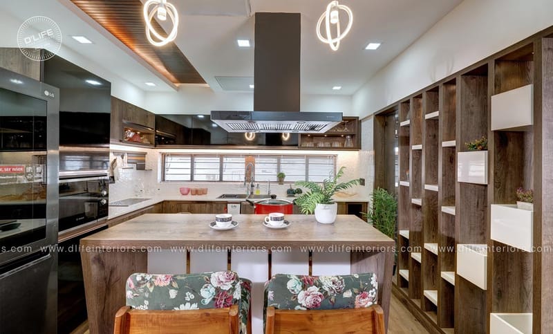 Modular kitchen with wood-finish cabinets, island breakfast bar and floral upholstered stools, Hyderabad