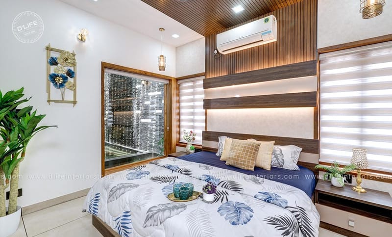 Bedroom with wood-slat headboard wall, navy floral bedding and zebra blinds, Hyderabad full-home interior