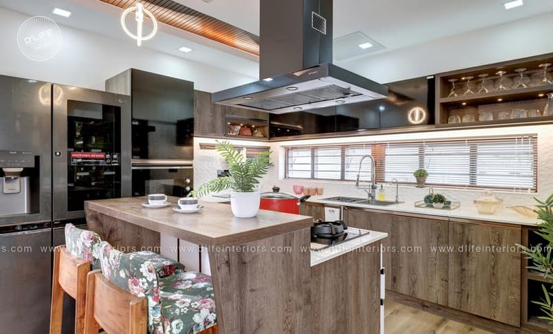 Modular kitchen blending wood and glossy black cabinets with island chimney and glass display unit, Hyderabad