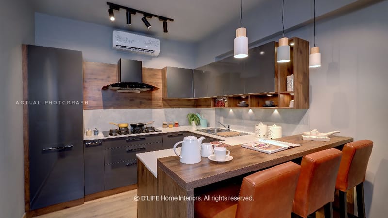 Compact L-shaped kitchen with grey cabinets, walnut open shelves and tan leather bar stools at a wood breakfast counter, Hyderabad