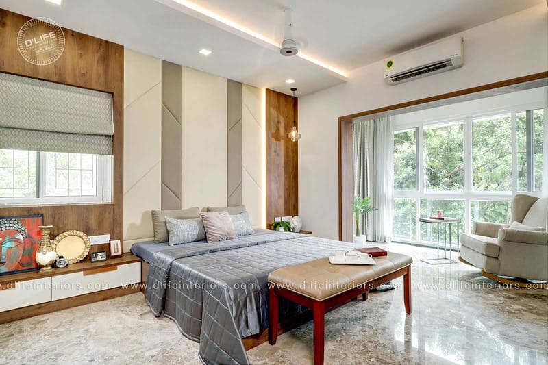 Master bedroom with upholstered headboard wall, teak panelling and large garden-view windows, Dlife full home Hyderabad