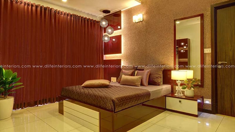 Bedroom with deep maroon drapes, textured wall, glass-globe pendants, brown quilted bedding and full-length mirror, Hyderabad