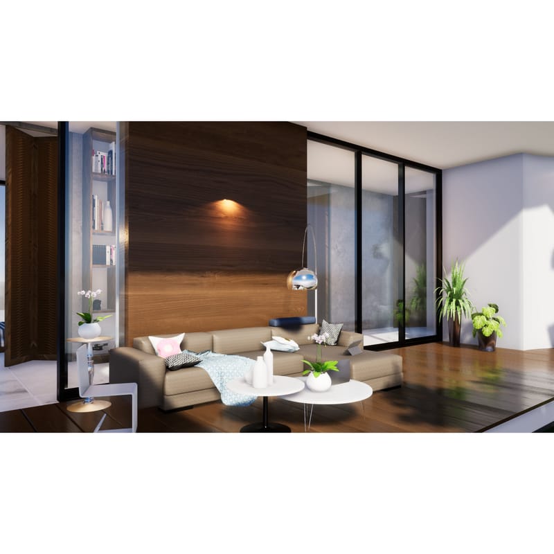 Living room with walnut feature wall, beige sectional sofa, arc lamp and built-in bookshelf opening to a deck, Hyderabad farmhouse