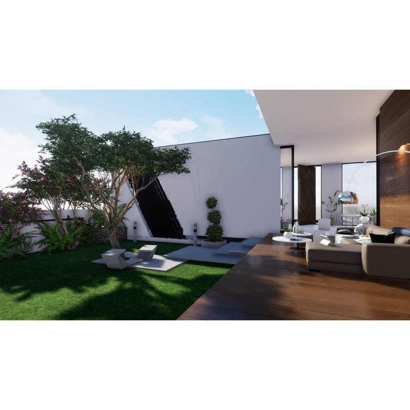 Backyard lawn and angled wall feature beside a sofa and timber deck in an open-plan farmhouse, Hyderabad