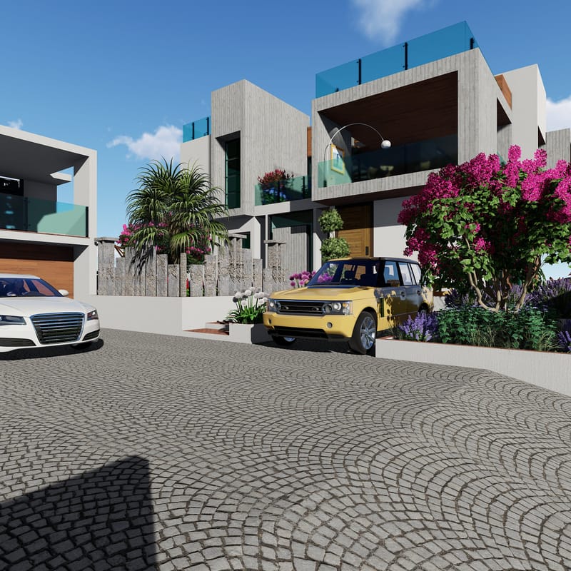 Two contemporary villas with stone and timber facades facing a fan-patterned cobblestone driveway with parked cars, Hyderabad