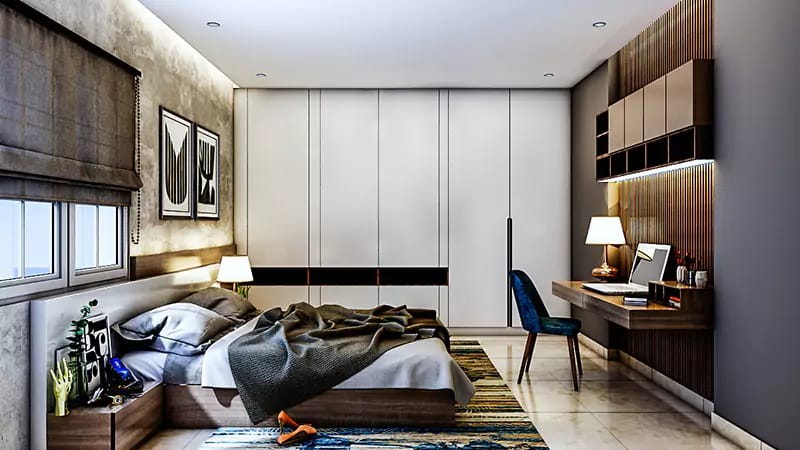 Bedroom with white sliding wardrobe, wood study unit, blue accent chair and patterned rug, Hyderabad