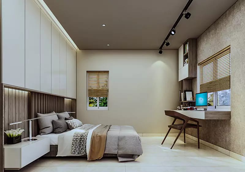 Warm-toned bedroom with fluted wood headboard, white wardrobe wall, track lights and corner study niche, Hyderabad