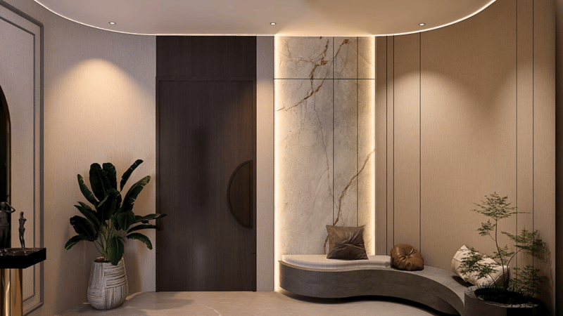 Curved foyer in Hyderabad with backlit marble accent panel, dark veneer door, built-in stone bench and potted greenery