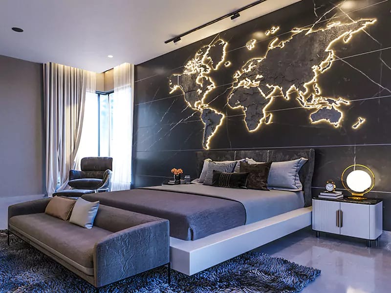 Luxury bedroom with illuminated world-map feature wall on black marble, grey platform bed and bench, Hyderabad