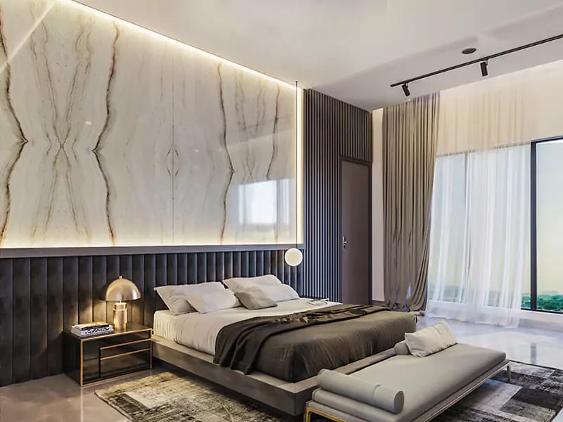 Master bedroom featuring a backlit marble headboard, dark fluted panelling and full-height windows, Hyderabad