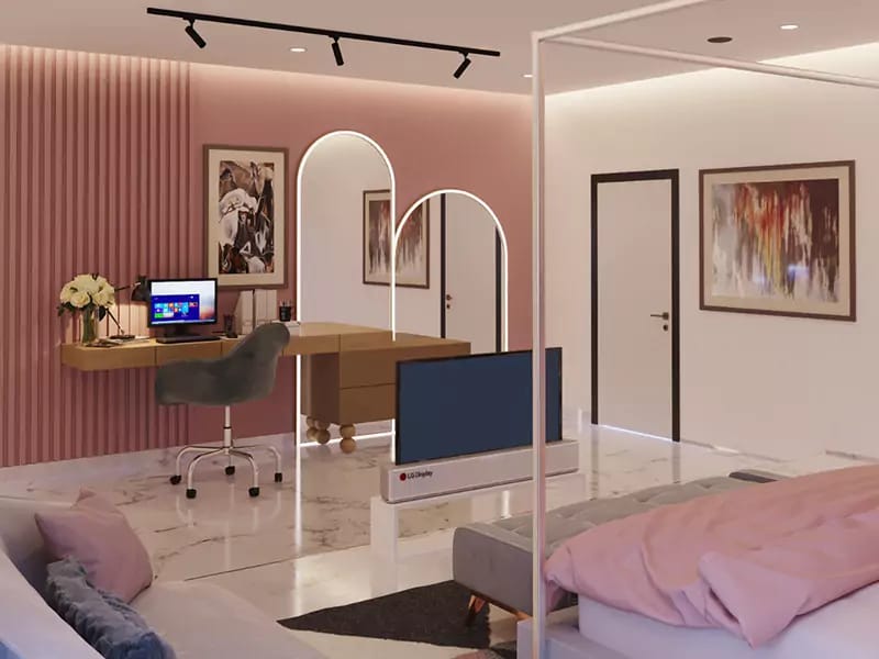 Bedroom workspace with fluted pink wall, floating wood desk, arched mirrors and framed abstract art, Hyderabad