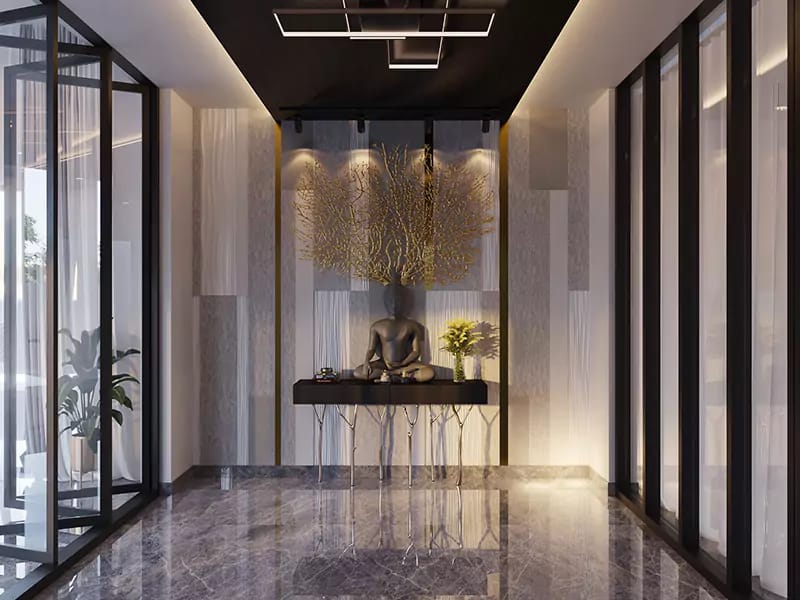 Foyer with gold coral wall sculpture, dark console, glass-partitioned entry and grey marble floor, Hyderabad